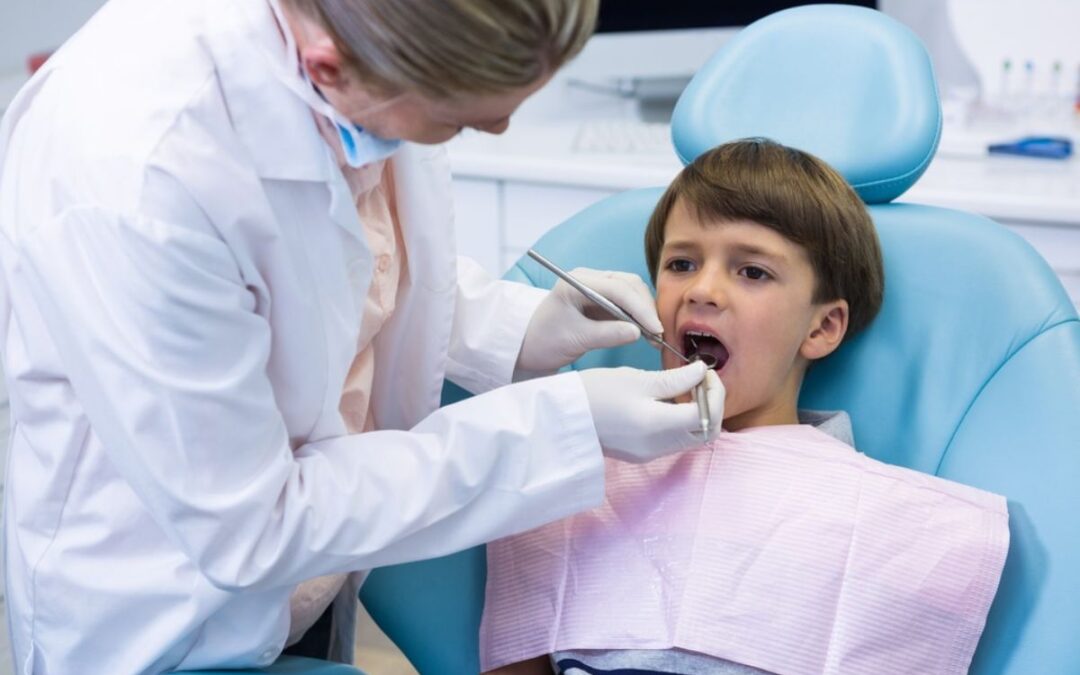 A child receiving dental care from a pediatric dentist.